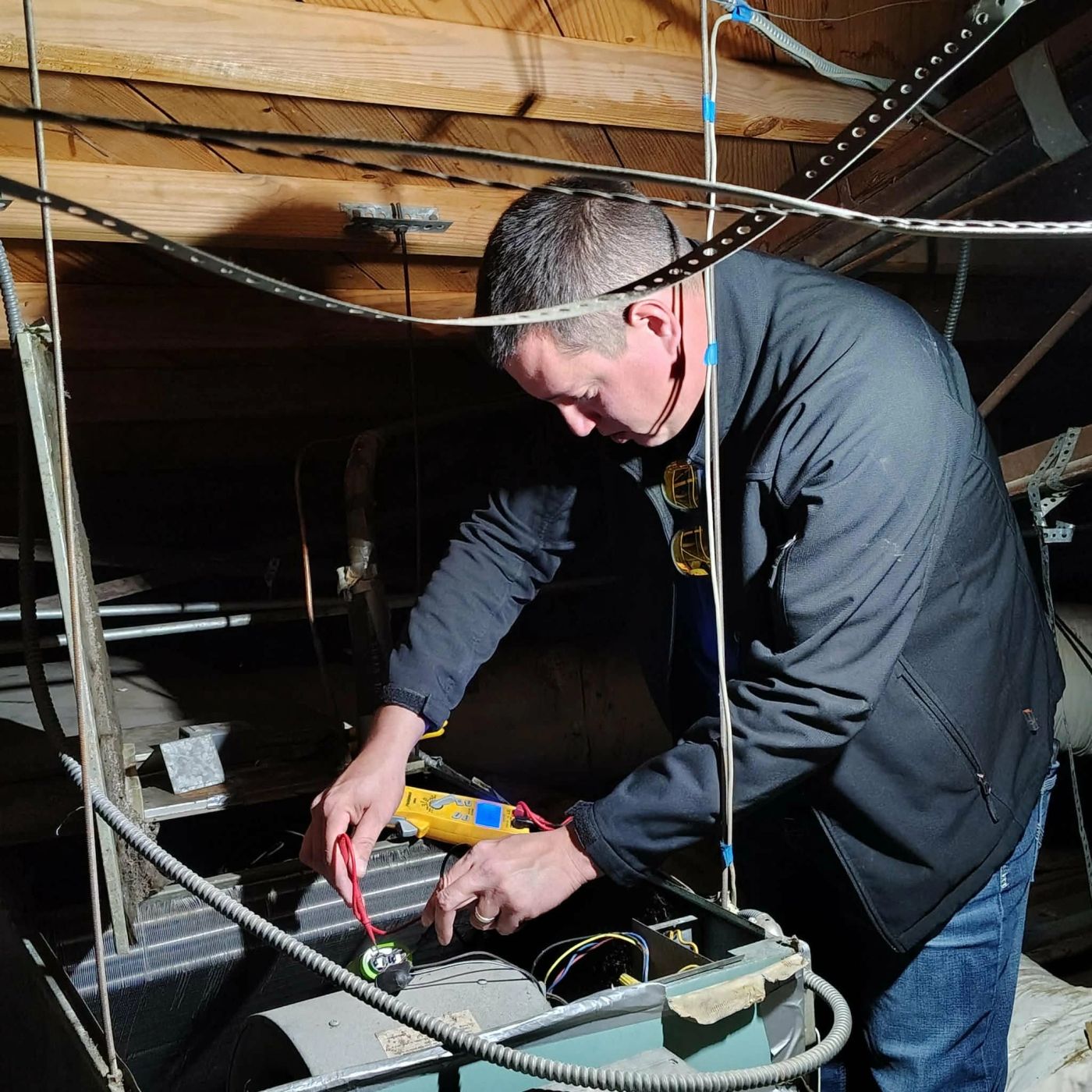 An Alvis Mechanical technician checking a system with a meter before quoting a repair